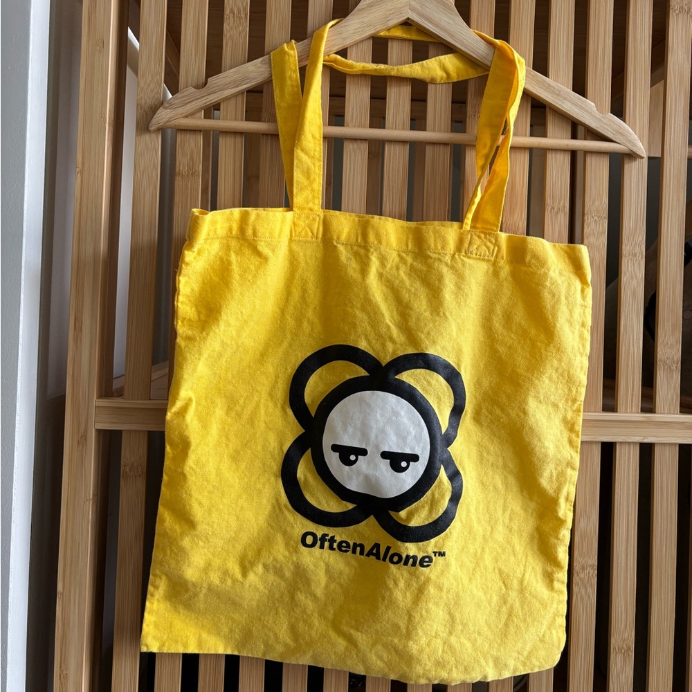 Often alone tote bag